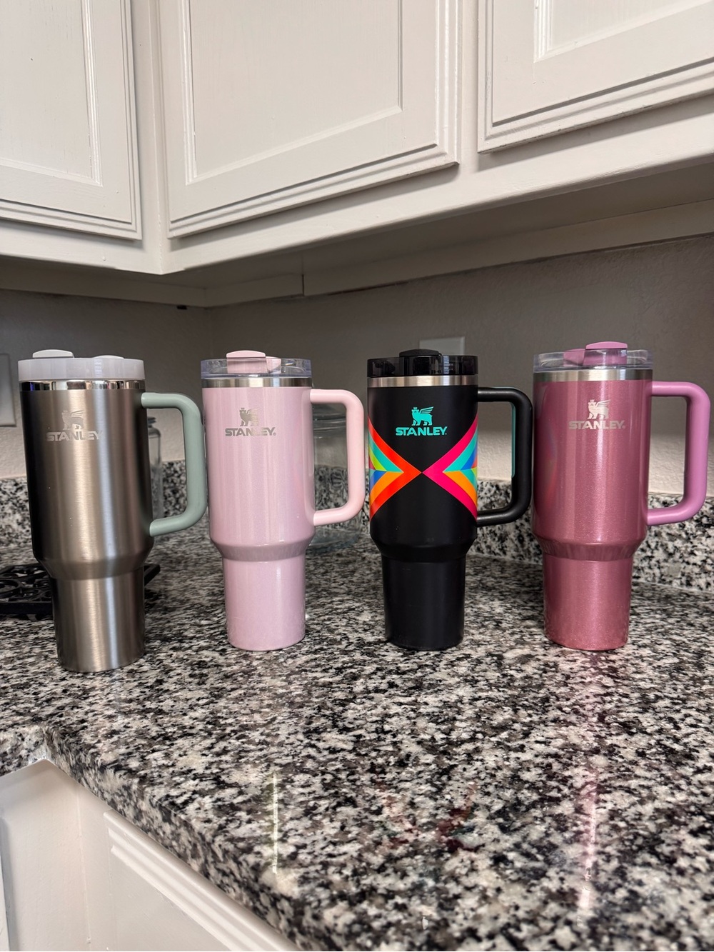 4 used lightly used Stanley 40oz cups , no straws